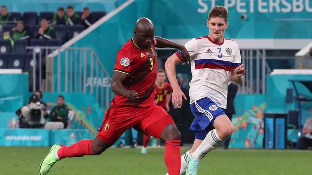 Soccer Football - Euro 2020 - Group B - Belgium v Russia - Gazprom Arena, Saint Petersburg, Russia - June 12, 2021 Belgium's Romelu Lukaku scores their third goal Pool via REUTERS/Evgenia Novozhenina