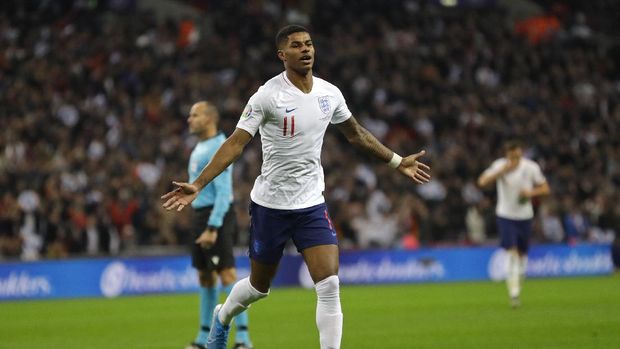 FILE - In this Thursday, Nov. 14, 2019 filer, England's Marcus Rashford celebrates scoring his side's fourth goal during the Euro 2020 group A qualifying soccer match between England and Montenegro at Wembley stadium in London. (AP Photo/Kirsty Wigglesworth, File)