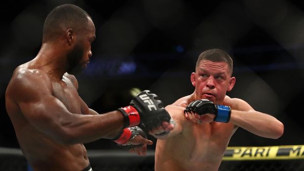 Jun 12, 2021; Glendale, Arizona, USA; Nate Diaz moves in for a hit as Leon Edwards defends during UFC 263 at Gila River Arena. Mandatory Credit: Mark J. Rebilas-USA TODAY Sports