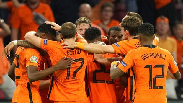 Netherlands players celebrate after Wout Weghorst of the Netherlands scored his side's second goal during the Euro 2020 soccer championship group C match between the Netherlands and Ukraine at the Johan Cruijff Arena in Amsterdam, Netherlands, Sunday, June 13, 2021. (AP Photo/Peter Dejong, Pool)