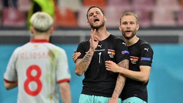 BUCHAREST, ROMANIA - JUNE 13: Marko Arnautovic of Austria celebrates with Konrad Laimer after scoring their side's third goal during the UEFA Euro 2020 Championship Group C match between Austria and North Macedonia at National Arena Bucharest on June 13, 2021 in Bucharest, Romania. (Photo by Daniel Mihailescu - Pool/Getty Images)