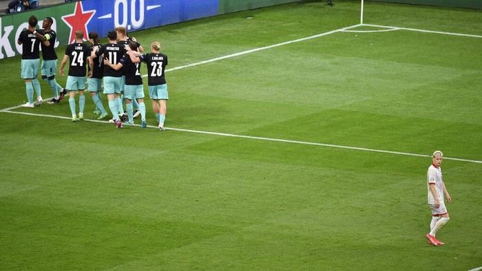 Marko Arnautovic, David Alaba Austria's Marko Arnautovic celebrates with teammates after scoring his side's 3rd goal during during the Euro 2020 soccer championship group C match between Austria and North Macedonia at the National Arena stadium in Bucharest, Romania, Sunday, June 13, 2021. (Mihai Barbu/Pool via AP)