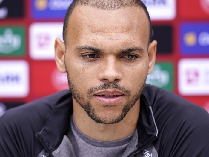 Danish player Martin Braithwaite speaks to the media, in Elsinore, Denmark, Monday, June 14, 2021. Denmark played their opening Euro 2020 group game against Finland on Saturday when during the first half Denmarks player Christian Eriksens heart stopped and and was given lengthy medical treatment before regaining consciousness. (Liselotte Sabroe/Ritzau Scanpix via AP)