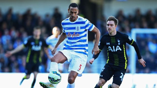 LONDON, ENGLAND - MARCH 07:  Rio Ferdinand of QPR clears the ball from Christian Eriksen of Spurs during the Barclays Premier League match between Queens Park Rangers and Tottenham Hotspur at Loftus Road on March 7, 2015 in London, England.  (Photo by Paul Gilham/Getty Images)
