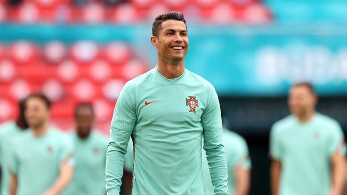 BUDAPEST, HUNGARY - JUNE 14: Cristiano Ronaldo smiles during the Portugal Training Session ahead of the Euro 2020 Group F match between Hungary and Portugal at Puskas Arena on June 14, 2021 in Budapest, Hungary. (Photo by Alex Pantling/Getty Images)