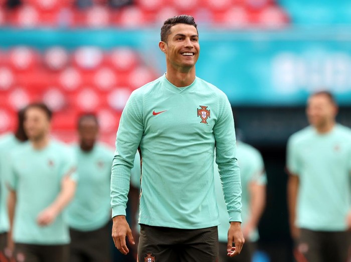 BUDAPEST, HUNGARY - JUNE 14: Cristiano Ronaldo smiles during the Portugal Training Session ahead of the Euro 2020 Group F match between Hungary and Portugal at Puskas Arena on June 14, 2021 in Budapest, Hungary. (Photo by Alex Pantling/Getty Images)