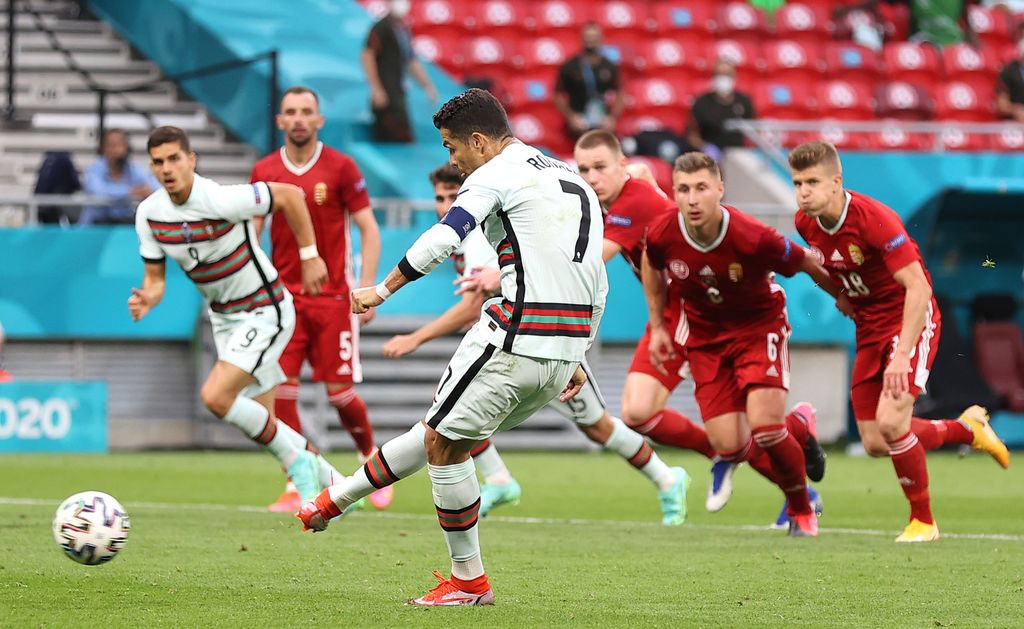 BUDAPEST, HUNGARY - JUNE 15: Cristiano Ronaldo of Portugal scores their side's second goal from the penalty spot during the UEFA Euro 2020 Championship Group F match between Hungary and Portugal at Puskas Arena on June 15, 2021 in Budapest, Hungary. (Photo by Alex Pantling/Getty Images)