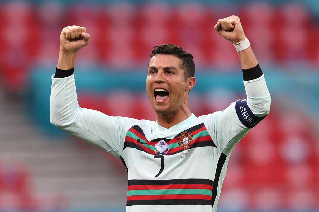 BUDAPEST, HUNGARY - JUNE 15: Cristiano Ronaldo of Portugal celebrates after victory in the UEFA Euro 2020 Championship Group F match between Hungary and Portugal at Puskas Arena on June 15, 2021 in Budapest, Hungary. (Photo by Alex Pantling/Getty Images)