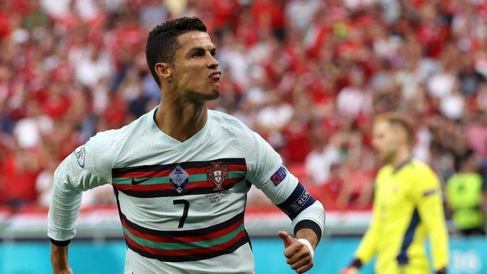 BUDAPEST, HUNGARY - JUNE 15: Cristiano Ronaldo of Portugal celebrates after scoring their sides second goal during the UEFA Euro 2020 Championship Group F match between Hungary and Portugal at Puskas Arena on June 15, 2021 in Budapest, Hungary. (Photo by Bernadett Szabo - Pool/Getty Images)