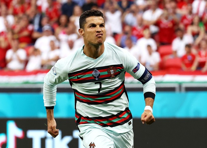 BUDAPEST, HUNGARY - JUNE 15: Cristiano Ronaldo of Portugal celebrates after scoring their sides second goal during the UEFA Euro 2020 Championship Group F match between Hungary and Portugal at Puskas Arena on June 15, 2021 in Budapest, Hungary. (Photo by Bernadett Szabo - Pool/Getty Images)