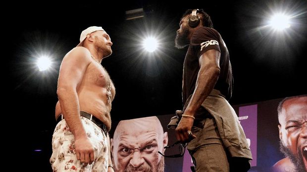 WBC Heavyweight Champion Tyson Fury, left and Deontay Wilder face off at a news conference in Los Angeles on Tuesday, June 15, 2021, in anticipation of their third heavyweight championship showdown scheduled for July 24 in Las Vegas. (AP Photo/Richard Vogel)
