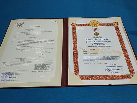 piagam penghargaan untuk Markis Kido