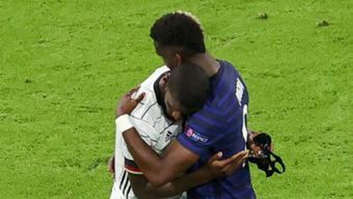 Paul Pogba, Antonio Ruediger Germany's defender Antonio Ruediger (L) is greeted by France's midfielder Paul Pogba (R) at the end of the UEFA EURO 2020 Group F football match between France and Germany at the Allianz Arena in Munich on June 15, 2021. (Photo by ALEXANDER HASSENSTEIN / POOL / AFP)