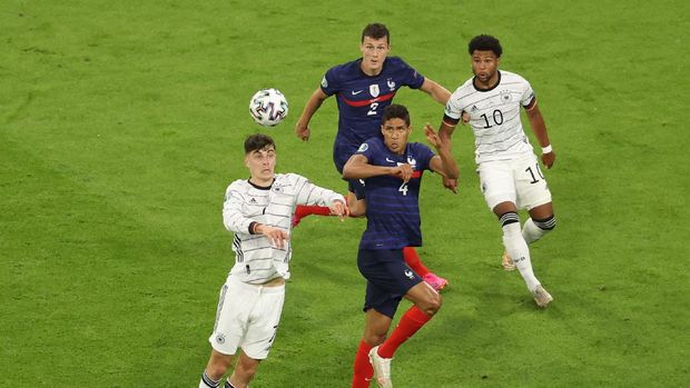 Soccer Football - Euro 2020 - Group F - France v Germany - Football Arena Munich, Munich, Germany - June 15, 2021 France's Raphael Varane in action with Germany's Kai Havertz Pool via REUTERS/Alexander Hassenstein