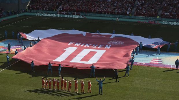 A giant jersey in support of Danish player Christian Eriksen is displayed ahead of the Euro 2020 soccer championship group B match between Denmark and Belgium at the Parken stadium in Copenhagen, Denmark, Thursday, June 17, 2021. Christian Eriksen was hospitalized after collapsing during Denmarks match with Finland. (Hannah McKay/Pool via AP)