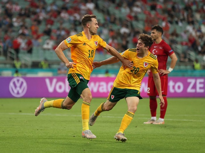 BAKU, AZERBAIJAN - JUNE 16: Aaron Ramsey of Wales celebrates with Daniel James after scoring their sides first goal during the UEFA Euro 2020 Championship Group A match between Turkey and Wales at Baku Olimpiya Stadionu on June 16, 2021 in Baku, Azerbaijan. (Photo by Naomi Baker/Getty Images)