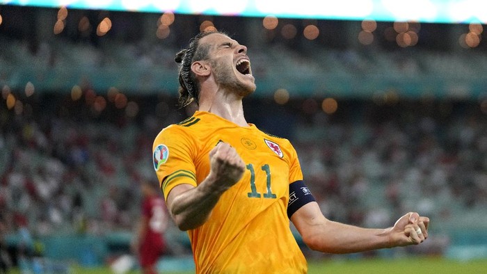 BAKU, AZERBAIJAN - JUNE 16: Gareth Bale of Wales celebrates after their sides second goal scored by Connor Roberts (Not pictured) during the UEFA Euro 2020 Championship Group A match between Turkey and Wales at Baku Olimpiya Stadionu on June 16, 2021 in Baku, Azerbaijan. (Photo by Darko Vojinovic - Pool/Getty Images)