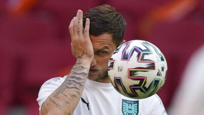 Austrias Marko Arnautovic rubs his eye during the training of the Austrian team at Johan Cruyff ArenA in Amsterdam, Netherlands, Wednesday, June 16, 2021, a day before the Euro 2020 soccer championship group C match between The Netherlands and Austria (AP Photo/Peter Dejong)