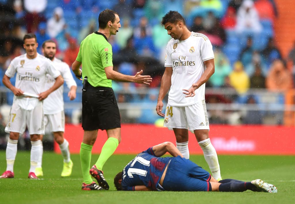 MADRID, SPAIN - SEPTEMBER 14: Casemiro of Real Madrid reacts after a tackle on Nikola Vukcevic of Levante UD during the La Liga match between Real Madrid CF and Levante UD at Estadio Santiago Bernabeu on September 14, 2019 in Madrid, Spain. (Photo by Denis Doyle/Getty Images)