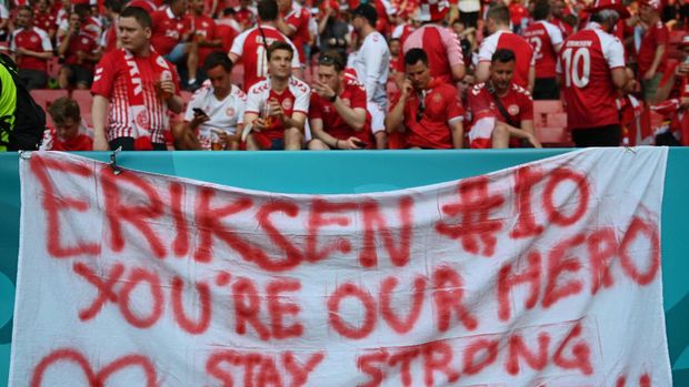 COPENHAGEN, DENMARK - JUNE 17: Fans of Denmark place a flag out with a message of love and support for Christian Eriksen of Denmark during the UEFA Euro 2020 Championship Group B match between Denmark and Belgium at Parken Stadium on June 17, 2021 in Copenhagen, Denmark. (Photo by Stuart Franklin/Getty Images)