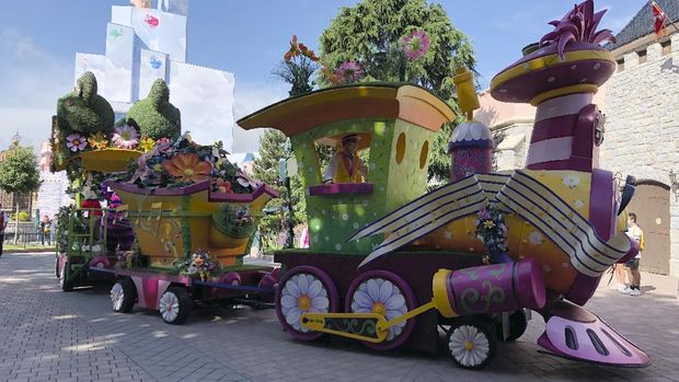 A float rides in Disneyland Paris in Marne-la-Vallée, east of Paris, Thursday, June 17, 2021. France's tourism sector takes a further step toward post-pandemic recovery with the reopening of Disneyland Paris, two weeks after the country formally welcomed back vaccinated foreign visitors. (AP Photo/Catherine Gaschka)