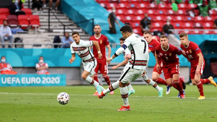 BUDAPEST, HUNGARY - JUNE 15: Cristiano Ronaldo of Portugal scores his sides second goal from the penalty spot during the UEFA Euro 2020 Championship Group F match between Hungary and Portugal on June 15, 2021 in Budapest, Hungary. (Photo by Alex Pantling/Getty Images)