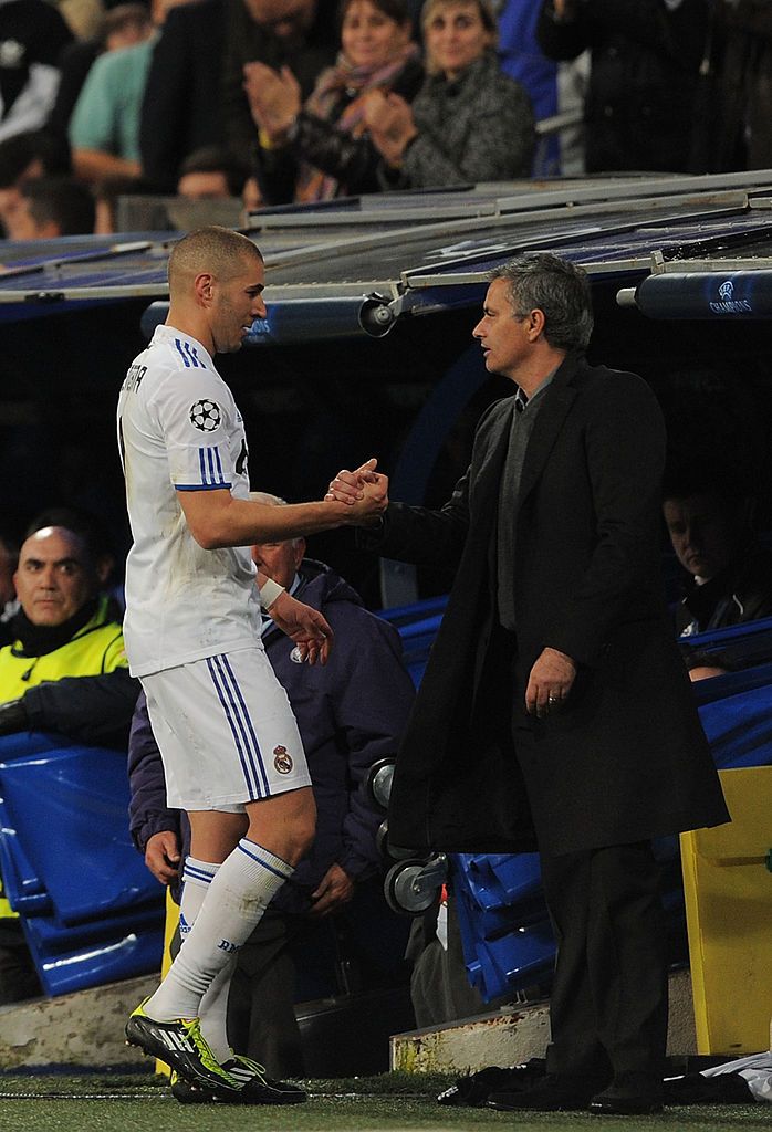 MADRID, SPAIN - MARCH 16:  Karim Benzema of Real Madrid shakes hands with head coach Jose Mourinho after being substituted during the UEFA Champions League round of 16 second leg match between Real Madrid and Lyon at Estadio Santiago Bernabeu on March 16, 2011 in Madrid, Spain.  (Photo by Denis Doyle/Getty Images)