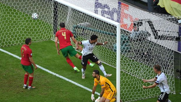 MUNICH, GERMANY - JUNE 19: Serge Gnabry of Germany celebrates their side's second goal, an own goal by Raphael Guerreiro of Portugal during the UEFA Euro 2020 Championship Group F match between Portugal and Germany at Football Arena Munich on June 19, 2021 in Munich, Germany. (Photo by Matthias Hangst/Getty Images)