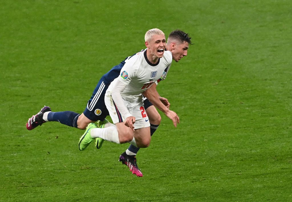 LONDON, ENGLAND - JUNE 18: Phil Foden of England is challenged by Billy Gilmour of Scotland during the UEFA Euro 2020 Championship Group D match between England and Scotland at Wembley Stadium on June 18, 2021 in London, England. (Photo by Facundo Arrizabalaga - Pool/Getty Images)