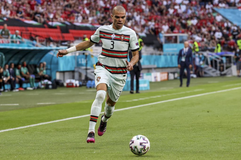 Portugal's Ruben Dias argues during the Euro 2020 soccer championship group F match between Hungary and Portugal at the Ferenc Puskas stadium in Budapest, Hungary, Tuesday, June 15, 2021. (Bernadett Szabo/Pool via AP)