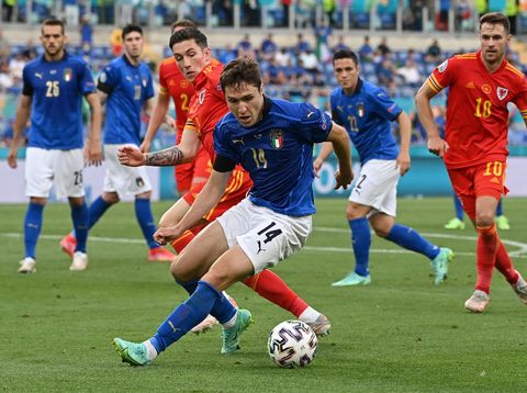 ROME, ITALY - JUNE 20: Federico Chiesa of Italy battles for possession with Harry Wilson of Wales during the UEFA Euro 2020 Championship Group A match between Italy and Wales at Olimpico Stadium on June 20, 2021 in Rome, Italy. (Photo by Andreas Solaro - Pool/Getty Images)
