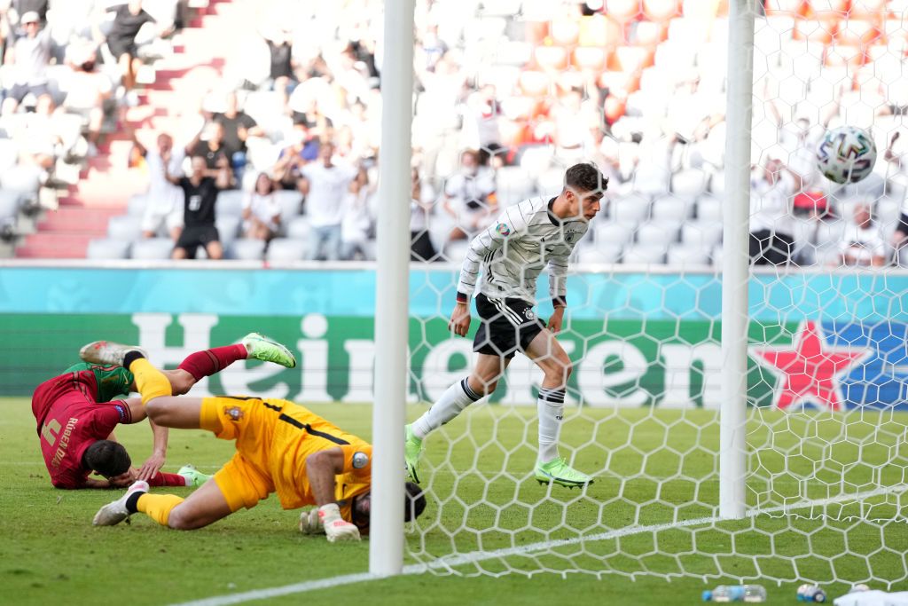 MUNICH, GERMANY - JUNE 19: Kai Havertz of Germany scores their side's third goal past Rui Patricio of Portugal during the UEFA Euro 2020 Championship Group F match between Portugal and Germany at Football Arena Munich on June 19, 2021 in Munich, Germany. (Photo by Alexander Hassenstein/Getty Images)