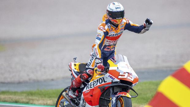 Rider Marc Marquez from Spain of Team Repsol Honda celebrates after winning the Moto GP race at the Sachsenring circuit in Hohenstein-Ernstthal, Germany, Sunday, June 20, 2021. (Jens Buettner/dpa via AP)