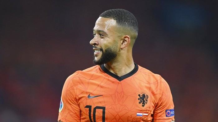 Memphis Depay of the Netherlands smiles during the Euro 2020 soccer championship group C match between the The Netherlands and Austria at Johan Cruijff ArenA in Amsterdam, Netherlands, Thursday, June 17, 2021. (John Thys, Pool via AP)