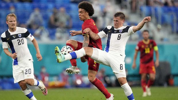 Finland's Robin Lod, right, tries to stop Belgium's Axel Witsel during the Euro 2020 soccer championship group B match between Finland and Belgium at Saint Petersburg stadium, in St. Petersburg, Russia, Monday, June 21, 2021. (AP Photo/Dmitri Lovetsky, Pool)