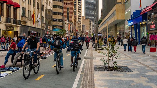 Pedestrianized central city street with cycleway that forms part of a network of bikeways known as the Ciclovia, and is part of a transformation project to prioritize sustainable mobility in the city of Bogota, Colombia