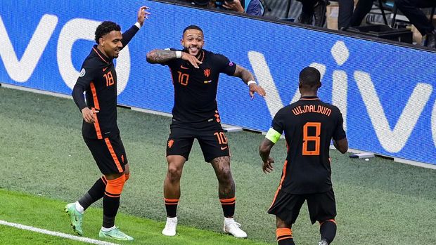 Dutch players celebrate after scoring their second goal during the Euro 2020 soccer championship group C match between The Netherlands and North Macedonia at the Johan Cruyff ArenA in Amsterdam, Netherlands, Monday, June 21, 2021. (Olaf Kraak, Pool via AP)