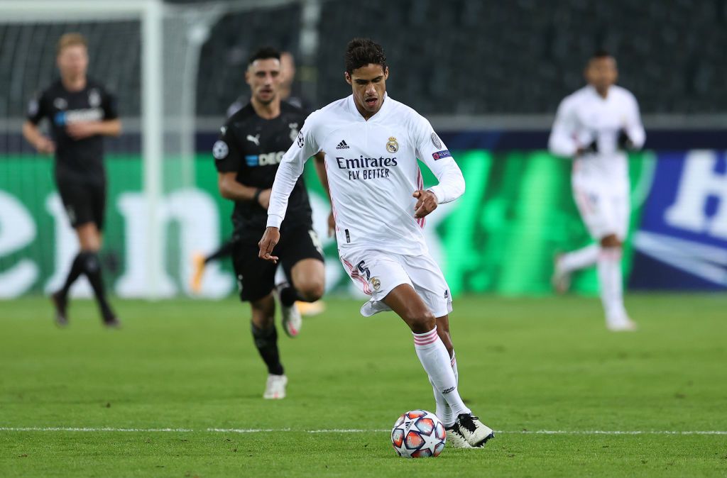 MOENCHENGLADBACH, GERMANY - OCTOBER 27: Raphael Varane of Mdrid runs with the ball during the UEFA Champions League Group B stage match between Borussia Moenchengladbach and Real Madrid at Borussia-Park on October 27, 2020 in Moenchengladbach, Germany. (Photo by Lars Baron/Getty Images)