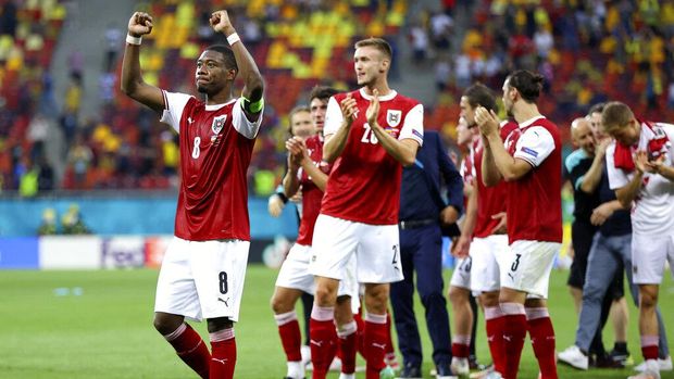 Austria's David Alaba celebrates after the Euro 2020 soccer championship group C match between Ukraine and Austria at the National Arena stadium in Bucharest, Monday, June 21, 2021. (Marko Djurica/Pool via AP)