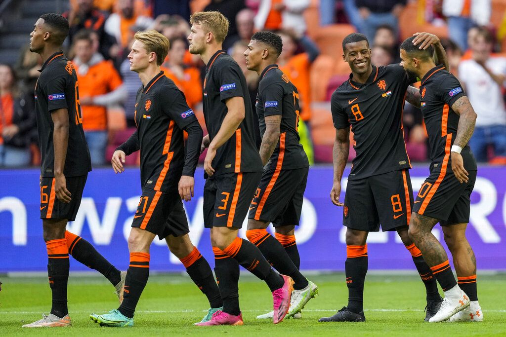 Dutch players celebrate after scoring their second goal during the Euro 2020 soccer championship group C match between The Netherlands and North Macedonia at the Johan Cruyff ArenA in Amsterdam, Netherlands, Monday, June 21, 2021. (AP Photo/Peter Dejong, Pool)