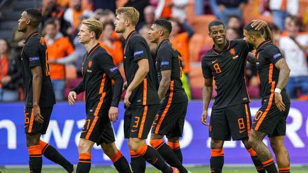 Dutch players celebrate after scoring their second goal during the Euro 2020 soccer championship group C match between The Netherlands and North Macedonia at the Johan Cruyff ArenA in Amsterdam, Netherlands, Monday, June 21, 2021. (AP Photo/Peter Dejong, Pool)