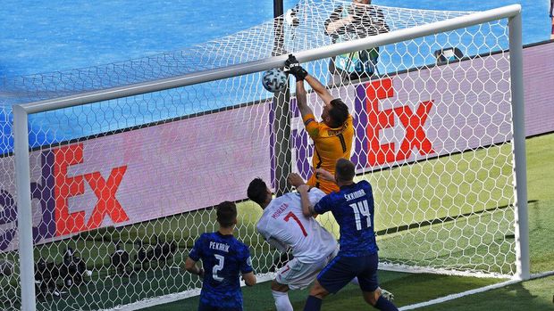 Slovakia's goalkeeper Martin Dubravka scores an own-goal while attempting to clear the ball during the Euro 2020 soccer championship group E match between Slovakia and Spain at La Cartuja Stadium in Seville, Spain, Wednesday June. 23, 2021. (Julio Munoz, Pool Photo via AP)