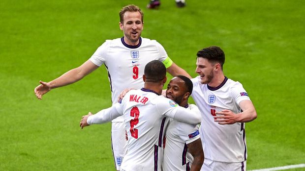 England's Raheem Sterling, second right, is congratulated by teammates England's Declan Rice, right, and Kyle Walker and Harry Kane, top, after scoring his team's first goal during the Euro 2020 soccer championship group D match between the Czech Republic and England at Wembley stadium, London, Tuesday, June 22, 2021.