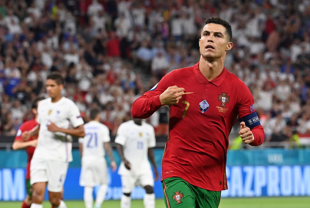 Cristiano Ronaldo, Portugal BUDAPEST, HUNGARY - JUNE 23: Cristiano Ronaldo of Portugal celebrates after scoring their side's first goal during the UEFA Euro 2020 Championship Group F match between Portugal and France at Puskas Arena on June 23, 2021 in Budapest, Hungary. (Photo by Tibor Illyes - Pool/Getty Images)