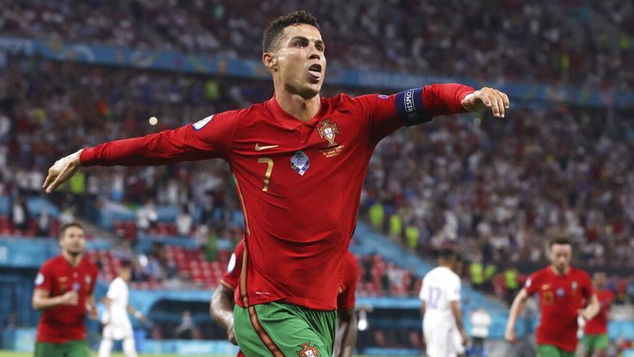 Portugals Cristiano Ronaldo celebrates after scoring his sides second goal during the Euro 2020 soccer championship group F match between Portugal and France at the Puskas Arena in Budapest, Wednesday, June 23, 2021. (Bernadett Szabo, Pool photo via AP)