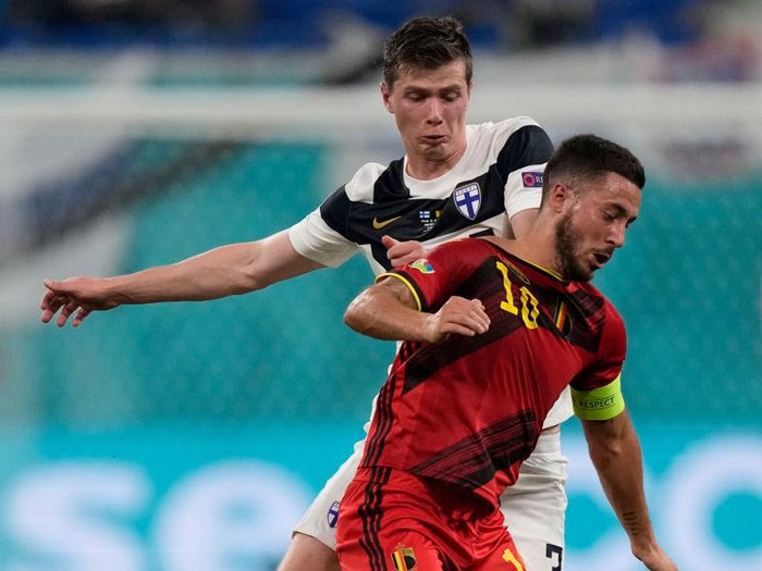 Eden Hazard SAINT PETERSBURG, RUSSIA - JUNE 21: Eden Hazard of Belgium battles for possession with Daniel O'Shaughnessy of Finland during the UEFA Euro 2020 Championship Group B match between Finland and Belgium at Saint Petersburg Stadium on June 21, 2021 in Saint Petersburg, Russia. (Photo by Dmitry Lovetsky - Pool/Getty Images)
