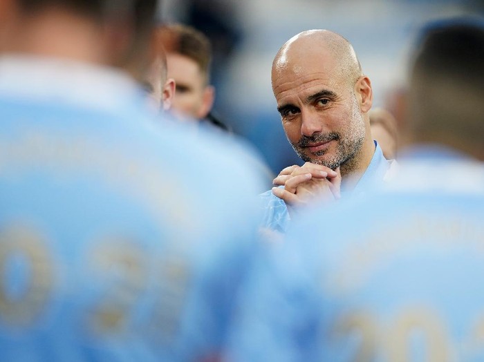 MANCHESTER, ENGLAND - MAY 23: Pep Guardiola, Manager of Manchester City reacts after Manchester City are presented with the Premier League Trophy as they win the league following the Premier League match between Manchester City and Everton at Etihad Stadium on May 23, 2021 in Manchester, England. A limited number of fans will be allowed into Premier League stadiums as Coronavirus restrictions begin to ease in the UK. (Photo by Dave Thompson - Pool/Getty Images)