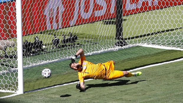Slovakia's goalkeeper Martin Dubravka scores an own-goal while attempting to clear the ball during the Euro 2020 soccer championship group E match between Slovakia and Spain at La Cartuja Stadium in Seville, Spain, Wednesday June. 23, 2021. (David Ramos, Pool photo via AP)