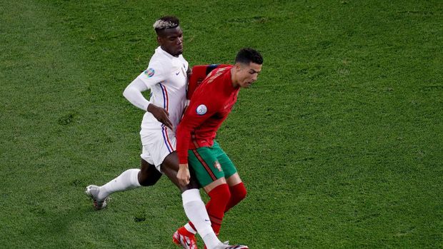 Paul Pogba BUDAPEST, HUNGARY - JUNE 23: Cristiano Ronaldo of Portugal is challenged by Paul Pogba of France during the UEFA Euro 2020 Championship Group F match between Portugal and France at Puskas Arena on June 23, 2021 in Budapest, Hungary. (Photo by Laszlo Balogh - Pool/Getty Images)