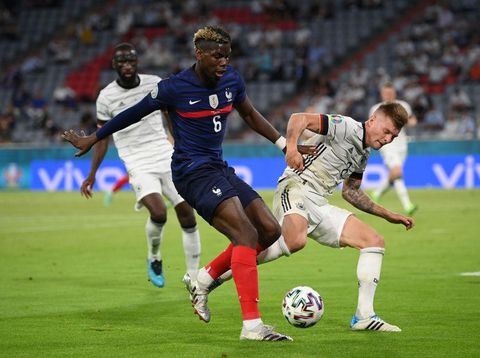 MUNICH, GERMANY - JUNE 15: Paul Pogba of France battles for possession with Toni Kroos of Germany during the UEFA Euro 2020 Championship Group F match between France and Germany at Football Arena Munich on June 15, 2021 in Munich, Germany. (Photo by Matthias Hangst/Getty Images)